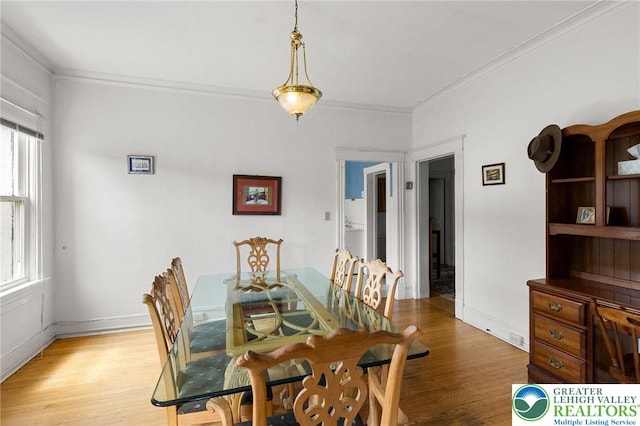 923 N Webster, Lackawanna, PA 18510 - dining room featuring healthy amount of natural light, light wood-style floors, crown molding, and baseboards