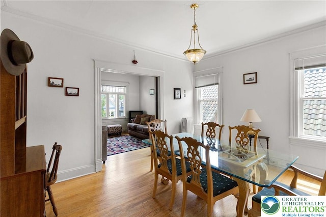 923 N Webster, Lackawanna, PA 18510 - dining space featuring light wood finished floors, ornamental molding, and baseboards