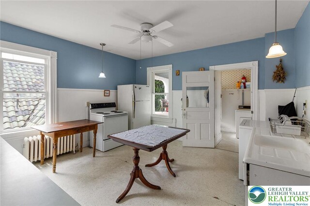 923 N Webster, Lackawanna, PA 18510 - kitchen with white appliances, radiator, a ceiling fan, decorative light fixtures, and wainscoting