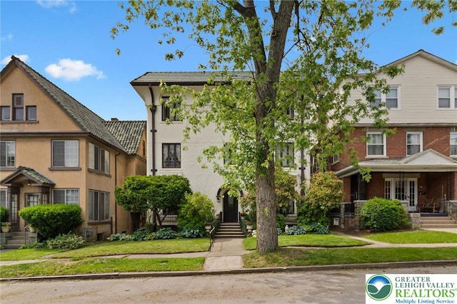 923 N Webster, Lackawanna, PA 18510 - townhome / multi-family property with a front yard and stucco siding