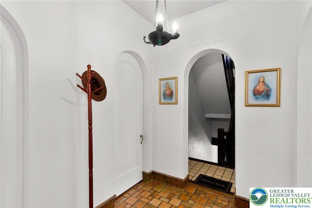 923 N Webster, Lackawanna, PA 18510 - hallway featuring arched walkways, baseboards, and brick patterned flooring