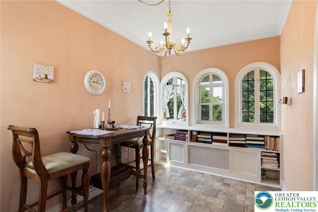 923 N Webster, Lackawanna, PA 18510 - dining area featuring a chandelier, stone finish floors, and ornamental molding