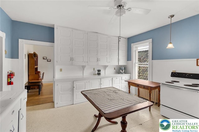 923 N Webster, Lackawanna, PA 18510 - kitchen with white electric range, white cabinetry, a ceiling fan, decorative light fixtures, and light countertops