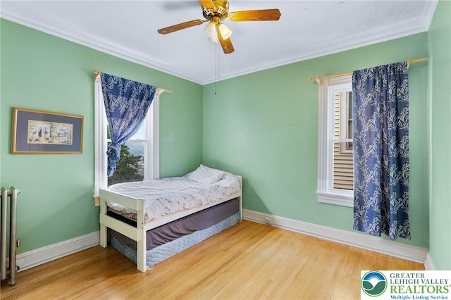 923 N Webster, Lackawanna, PA 18510 - bedroom with multiple windows, wood finished floors, baseboards, and crown molding