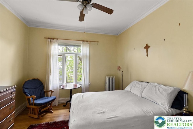 923 N Webster, Lackawanna, PA 18510 - bedroom featuring radiator heating unit, wood finished floors, ornamental molding, baseboards, and ceiling fan