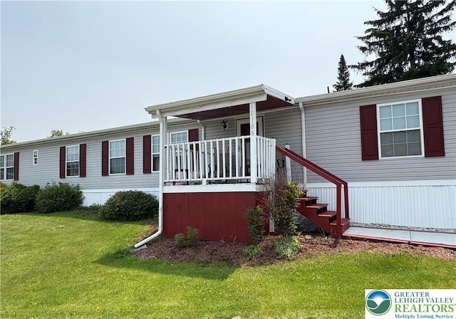 10188 Cork Ln, Upper Macungie Twp, PA 18031 - manufactured / mobile home featuring a front lawn and covered porch