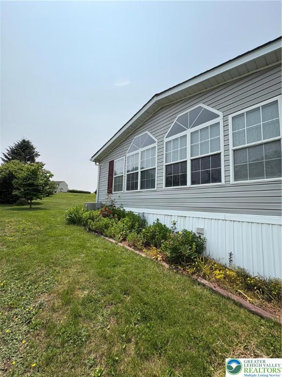10188 Cork Ln, Upper Macungie Twp, PA 18031 - view of property exterior featuring a lawn