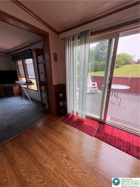 10188 Cork Ln, Upper Macungie Twp, PA 18031 - unfurnished dining area with a textured ceiling and wood finished floors