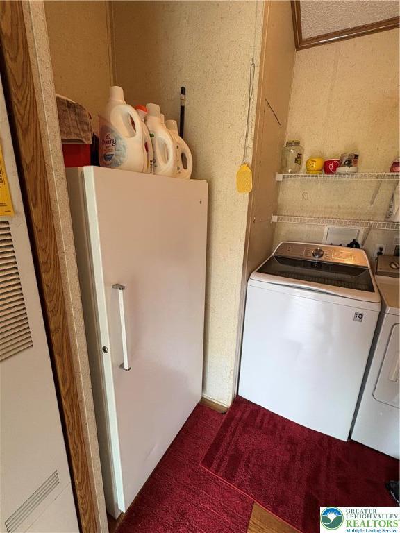 10188 Cork Ln, Upper Macungie Twp, PA 18031 - laundry room featuring washer and dryer, carpet, and a heating unit