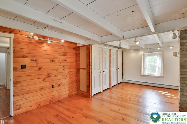 3679 Friedens Rd, Washington Twp, PA 18080 - below grade area featuring a baseboard heating unit, light wood finished floors, wooden walls, and wood ceiling