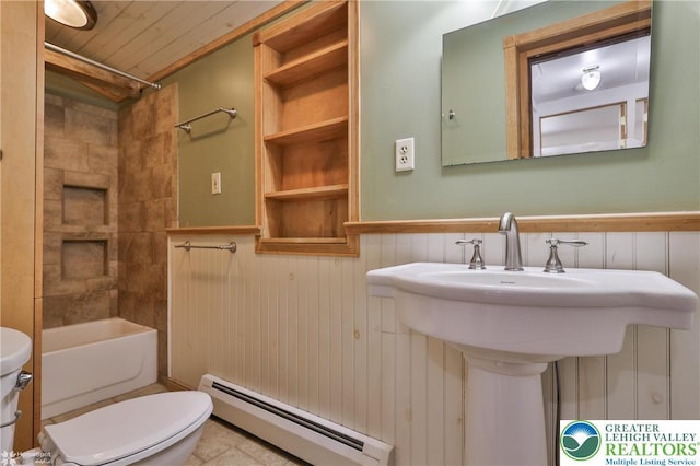 3679 Friedens Rd, Washington Twp, PA 18080 - full bath featuring a baseboard radiator, toilet, a wainscoted wall, bathtub / shower combination, and a sink