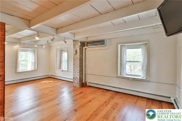 3679 Friedens Rd, Washington Twp, PA 18080 - spare room featuring baseboard heating, healthy amount of natural light, light wood-type flooring, and wood ceiling with exposed beams