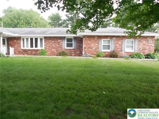 3554 Magnolia Dr, Bethlehem Twp, PA 18045 - ranch-style house featuring brick siding and a front yard