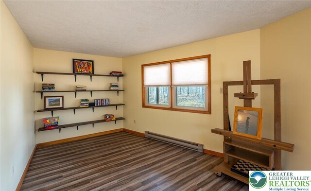 354 Kilmer Trl, Penn Forest Twp, PA 18210 - interior space featuring baseboard heating, baseboards, wood finished floors, and a textured ceiling