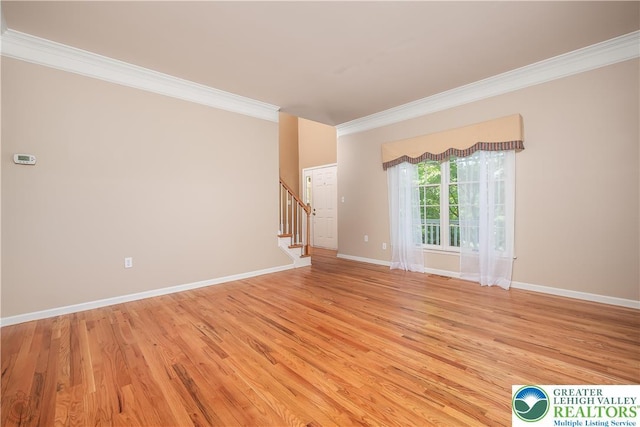 730 Buttermilk Rd, Williams Twp, PA 18055 - spare room featuring crown molding, stairs, light wood-type flooring, and baseboards
