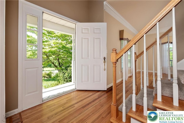 730 Buttermilk Rd, Williams Twp, PA 18055 - entryway with ornamental molding, light wood finished floors, stairway, and baseboards