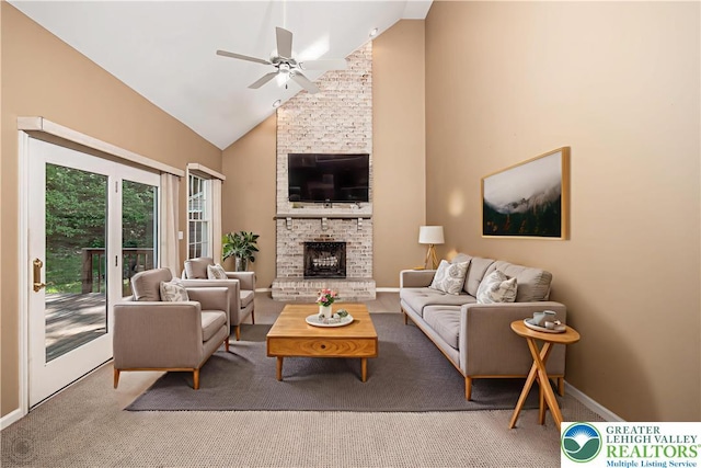 730 Buttermilk Rd, Williams Twp, PA 18055 - living room with ceiling fan, carpet, a large fireplace, high vaulted ceiling, and baseboards