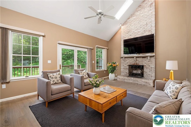 730 Buttermilk Rd, Williams Twp, PA 18055 - living area with wood finished floors, healthy amount of natural light, a fireplace, ceiling fan, and high vaulted ceiling
