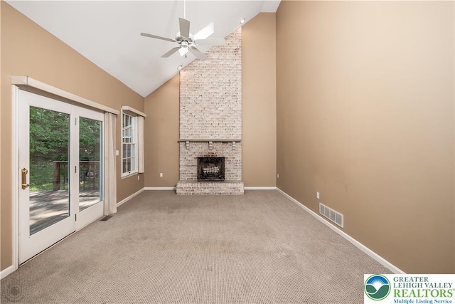 730 Buttermilk Rd, Williams Twp, PA 18055 - unfurnished living room featuring high vaulted ceiling, ceiling fan, carpet flooring, baseboards, and a fireplace