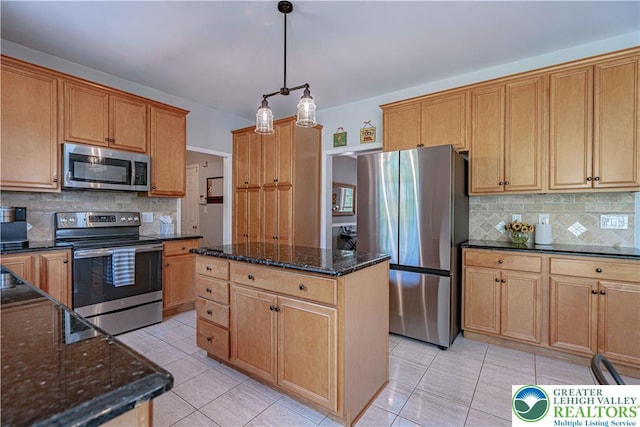 697 Ryan Dr, South Whitehall Twp, PA 18103 - kitchen with stainless steel appliances, light tile patterned flooring, a kitchen island, and backsplash