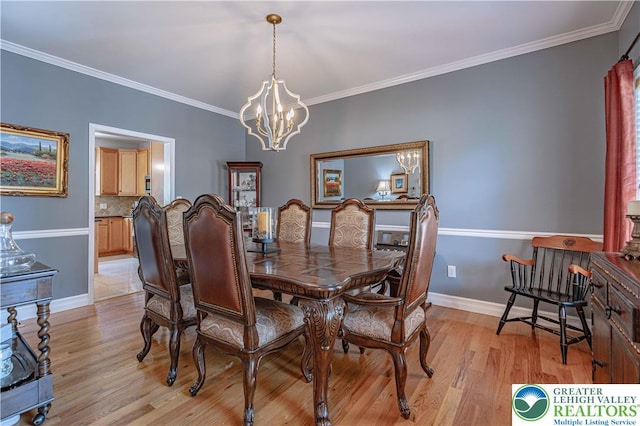 697 Ryan Dr, South Whitehall Twp, PA 18103 - dining room featuring a chandelier, light wood-style flooring, crown molding, and baseboards