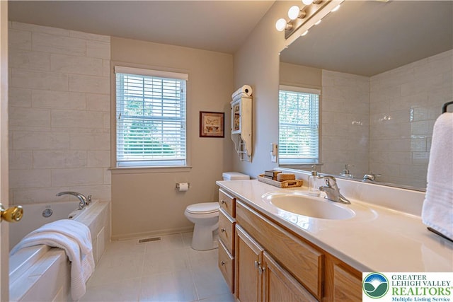 697 Ryan Dr, South Whitehall Twp, PA 18103 - full bathroom with healthy amount of natural light, vanity, a garden tub, and toilet