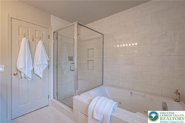697 Ryan Dr, South Whitehall Twp, PA 18103 - full bathroom featuring a shower stall, a tub with jets, and tile patterned flooring