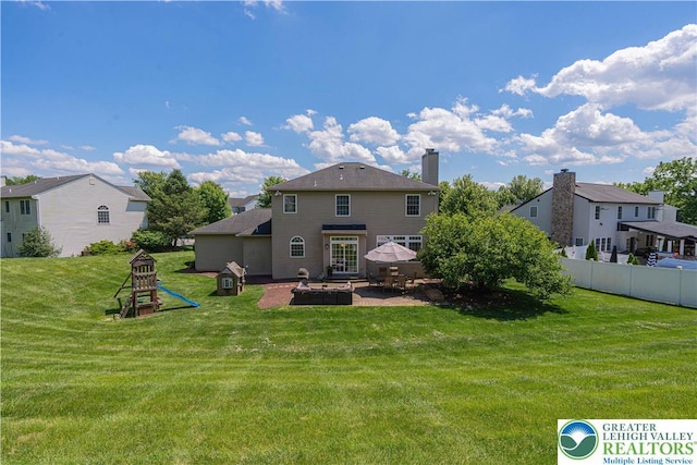 697 Ryan Dr, South Whitehall Twp, PA 18103 - rear view of property with a patio, a chimney, and a residential view