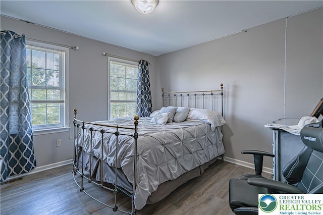 697 Ryan Dr, South Whitehall Twp, PA 18103 - bedroom featuring multiple windows, wood finished floors, and baseboards