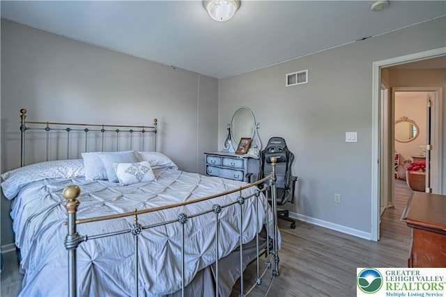 697 Ryan Dr, South Whitehall Twp, PA 18103 - bedroom with wood finished floors and baseboards