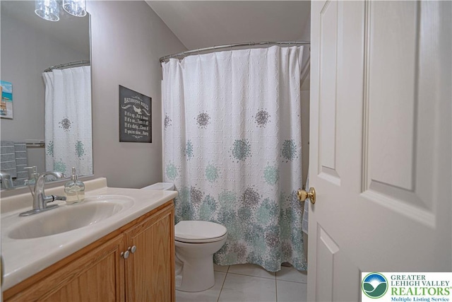 697 Ryan Dr, South Whitehall Twp, PA 18103 - full bath with tile patterned floors, vanity, and toilet