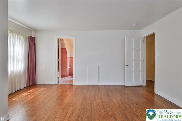 145 N Main St, Allentown City, PA 18104 - empty room with wood finished floors and baseboards