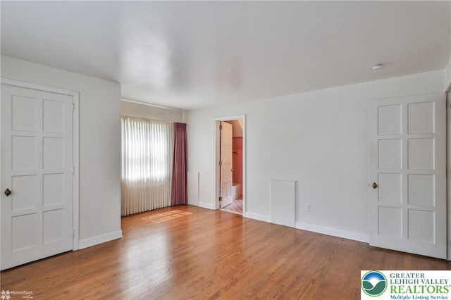 145 N Main St, Allentown City, PA 18104 - unfurnished bedroom featuring wood finished floors and baseboards