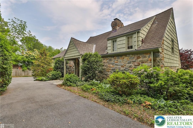 145 N Main St, Allentown City, PA 18104 - view of home's exterior with stone siding and a chimney
