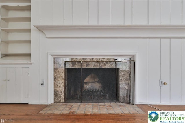 145 N Main St, Allentown City, PA 18104 - detailed view of a tiled fireplace and wood finished floors