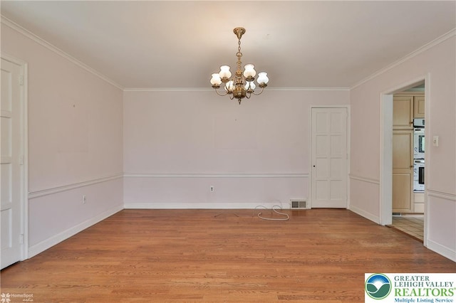 145 N Main St, Allentown City, PA 18104 - unfurnished dining area featuring a chandelier, light wood-style flooring, crown molding, and baseboards
