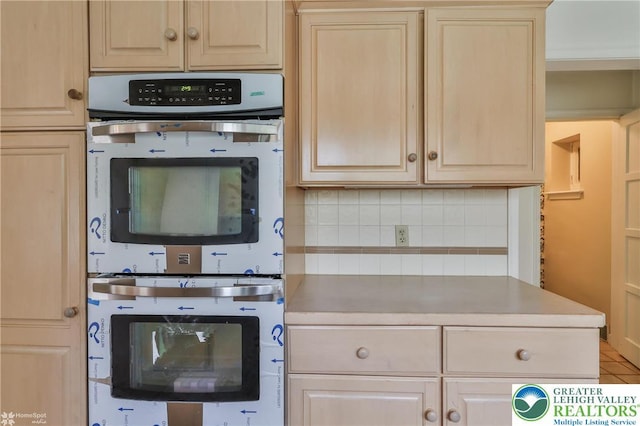 145 N Main St, Allentown City, PA 18104 - kitchen featuring light brown cabinetry, stainless steel double oven, and decorative backsplash