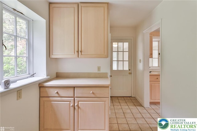 145 N Main St, Allentown City, PA 18104 - kitchen featuring light brown cabinets, light countertops, and light tile patterned flooring