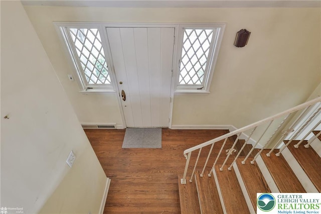 145 N Main St, Allentown City, PA 18104 - entrance foyer with stairs, wood finished floors, and baseboards