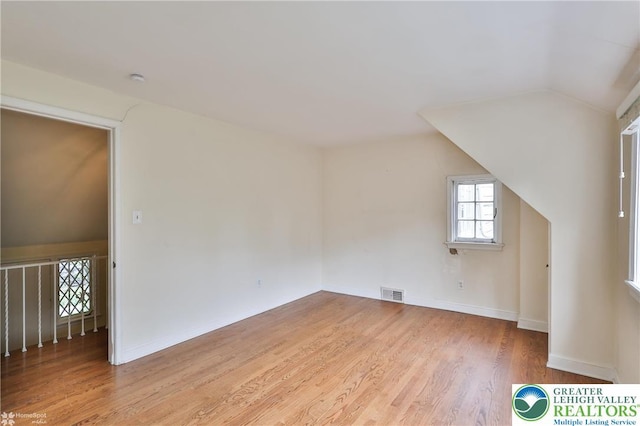 145 N Main St, Allentown City, PA 18104 - bonus room with light wood-style floors, vaulted ceiling, and baseboards