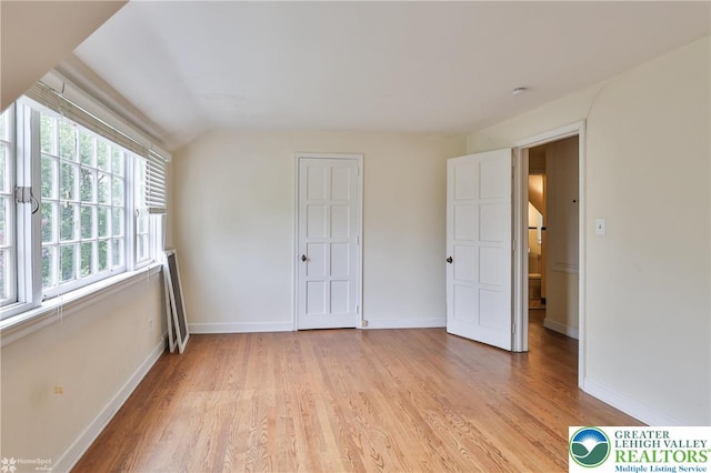 145 N Main St, Allentown City, PA 18104 - unfurnished bedroom with light wood-style floors, baseboards, and vaulted ceiling