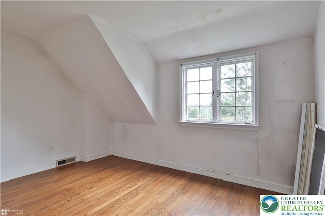 145 N Main St, Allentown City, PA 18104 - additional living space with wood finished floors, vaulted ceiling, and baseboards