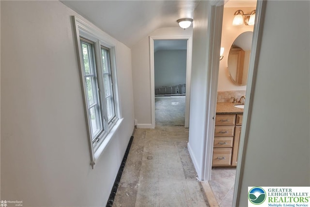 145 N Main St, Allentown City, PA 18104 - corridor featuring lofted ceiling, baseboards, and a sink