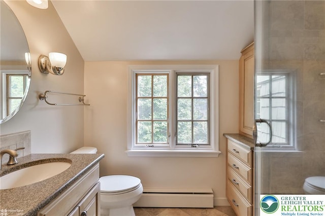 145 N Main St, Allentown City, PA 18104 - bathroom with a baseboard heating unit, toilet, lofted ceiling, vanity, and tile patterned floors
