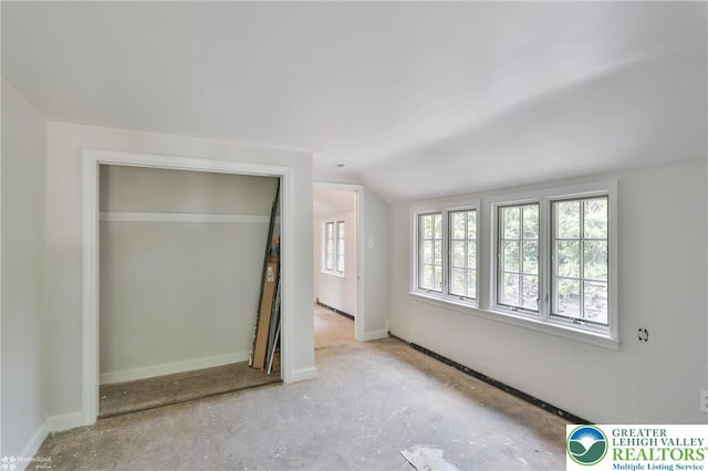 145 N Main St, Allentown City, PA 18104 - unfurnished bedroom with multiple windows, lofted ceiling, and baseboards