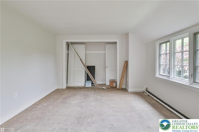 145 N Main St, Allentown City, PA 18104 - empty room featuring a baseboard heating unit and lofted ceiling