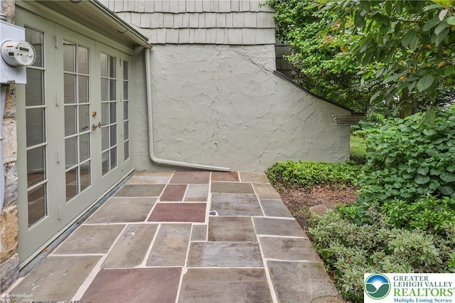 145 N Main St, Allentown City, PA 18104 - exterior view of french doors, electric meter, and stucco siding
