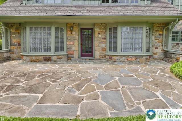 145 N Main St, Allentown City, PA 18104 - doorway to property with stone siding and a patio area