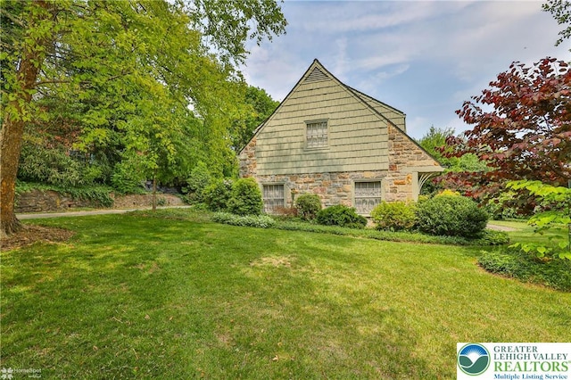 145 N Main St, Allentown City, PA 18104 - view of property exterior featuring stone siding and a lawn