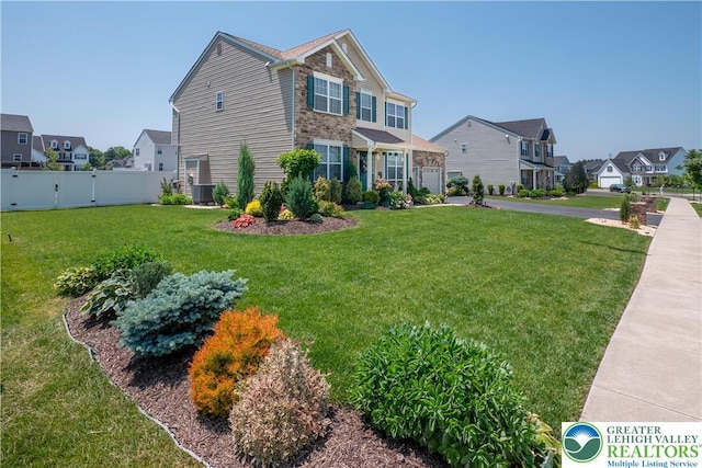 1043 Lisa Ln, Palmer Twp, PA 18045 - view of front facade featuring a residential view, a garage, asphalt driveway, and central AC